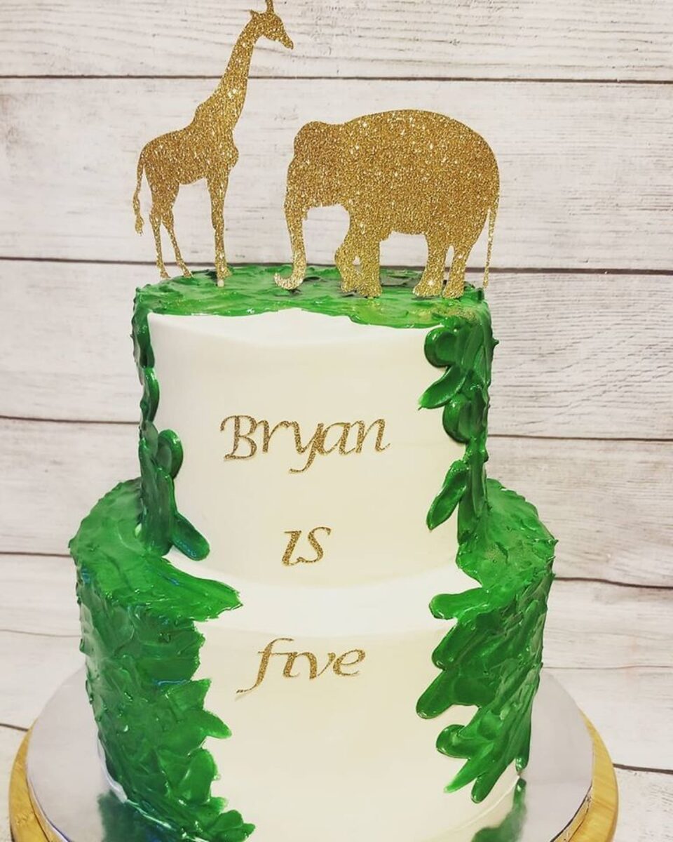 Safari jungle 5th birthday cake with gold animal toppers